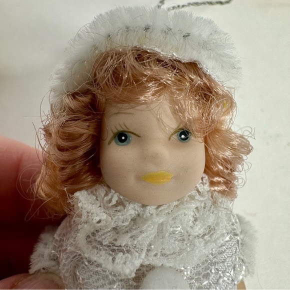 NWT. 7 porcelain doll ornaments. 5 of little girl and 2 of baby. - Picture 13 of 14